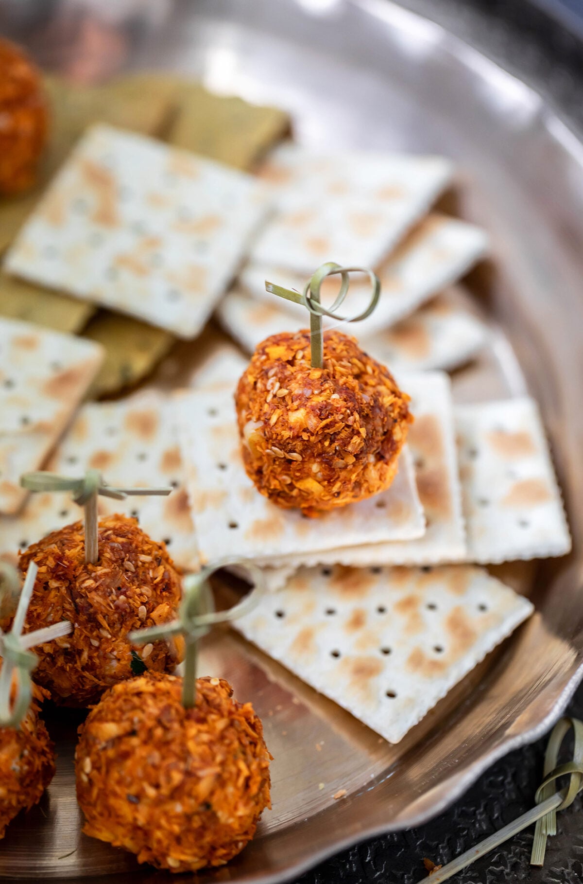 cheese truffle placed on a cracker