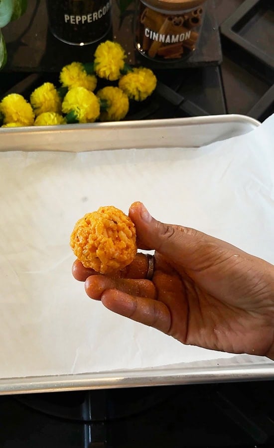 hand showing a rolled arancini