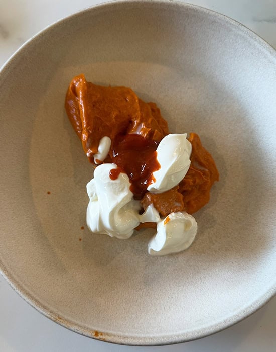 sour cream with tomato sauce in a bowl