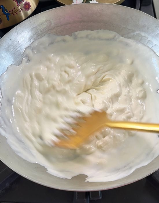 melted ricotta cheese in a kadai