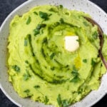 mashed potatoes with a pat of butter in a bowl