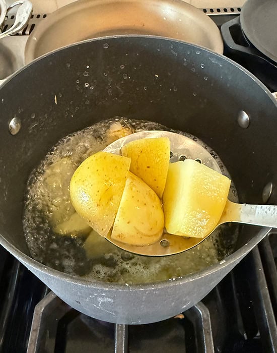 spatula showing par boiled cauliflower florets