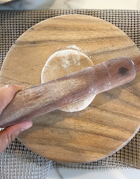 rolling dough with a rolling pin