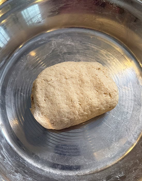 kneaded atta in a steel plate