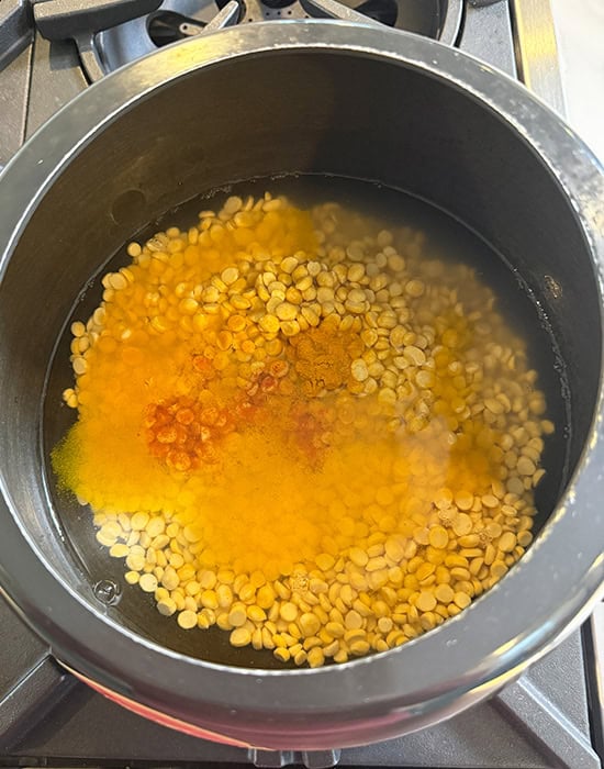 dal with turmeric salt in a pressure cooker