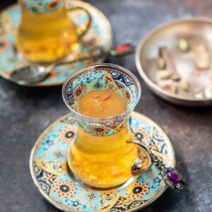 kahwa served in a turkish blue color tea cup with plate
