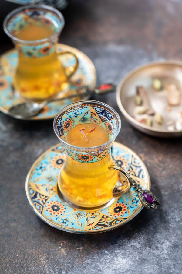 kahwa served in a turkish blue color tea cup with plate