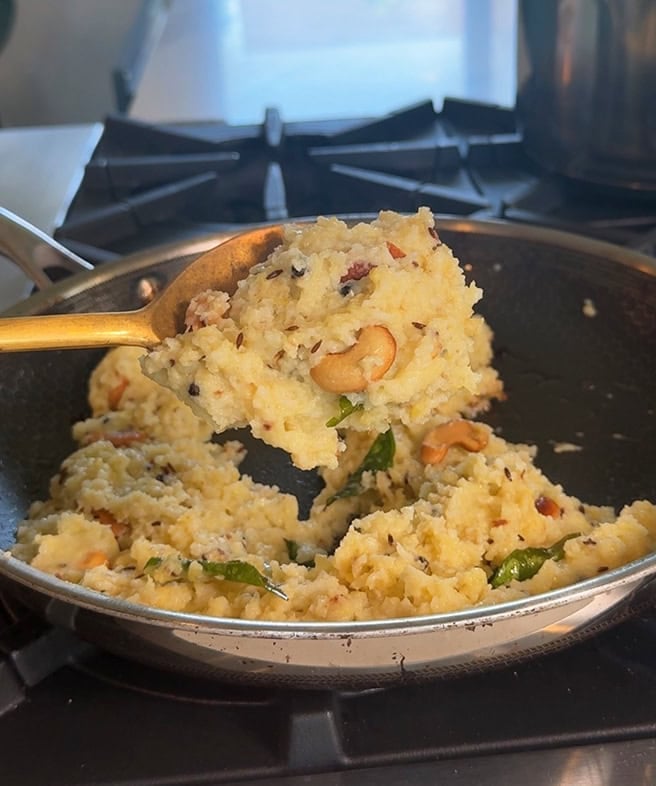 rice dal mixed with spices in a pan