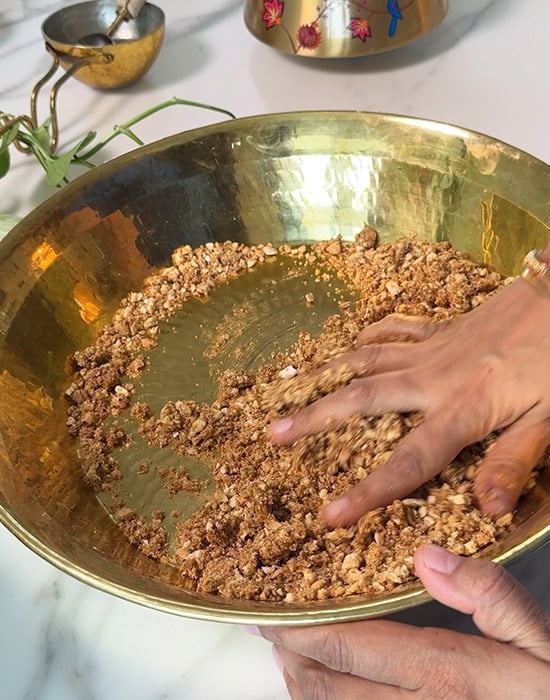 hand mixing ladoo ingredients