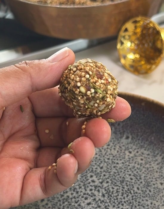hand showing rolled mukhwas ball