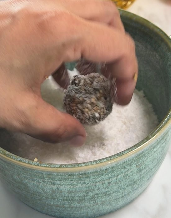 rolling mukhwas ball into coconut