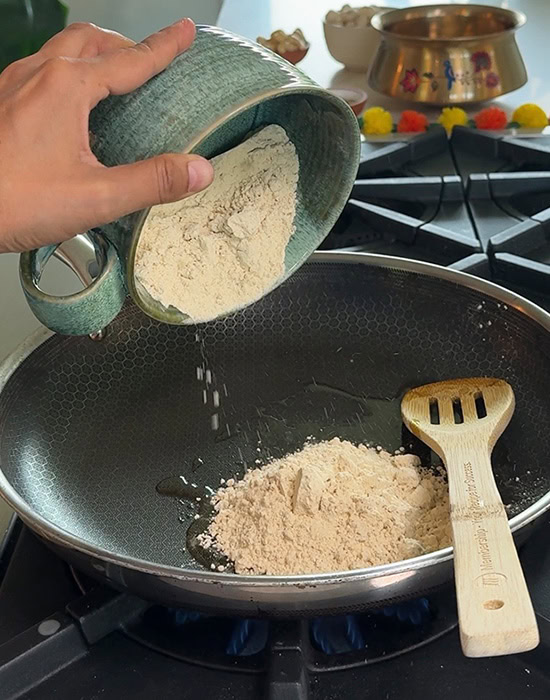 bowl adding sattu to a pan
