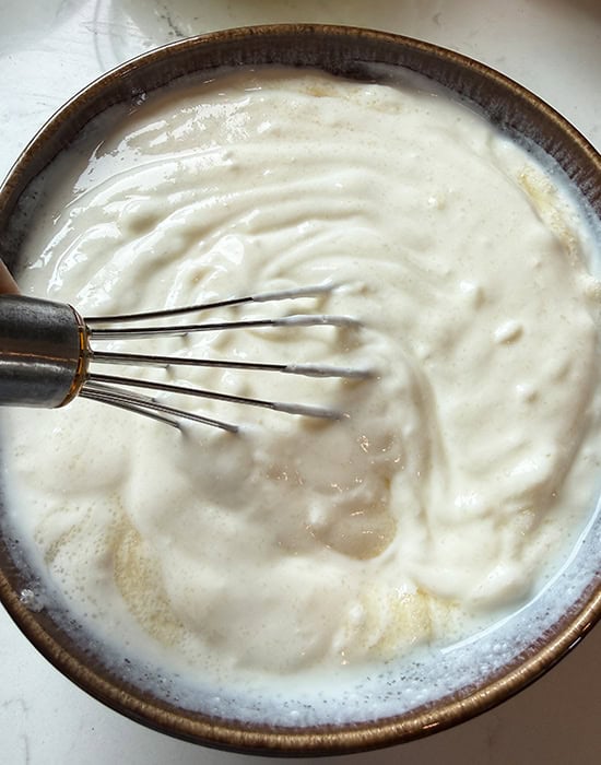 wire whisk whisking yogurt